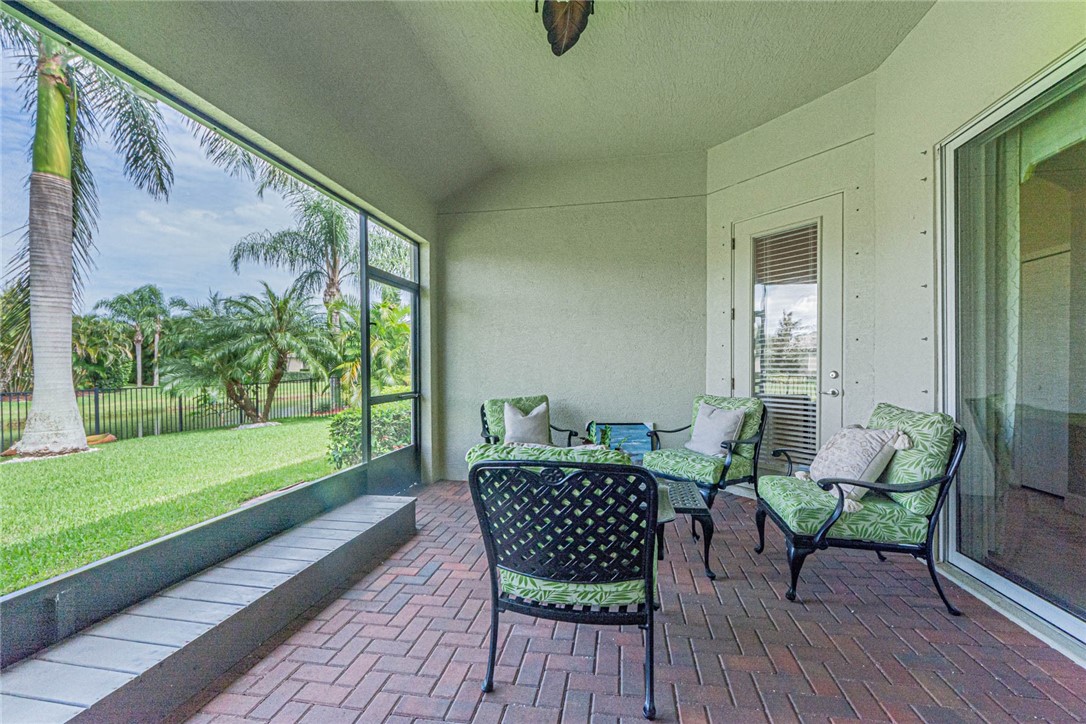 4250 Diamond Square Vero Beach, FL 32967 - Photo 27 of 33 a outdoor living space with furniture and garden view