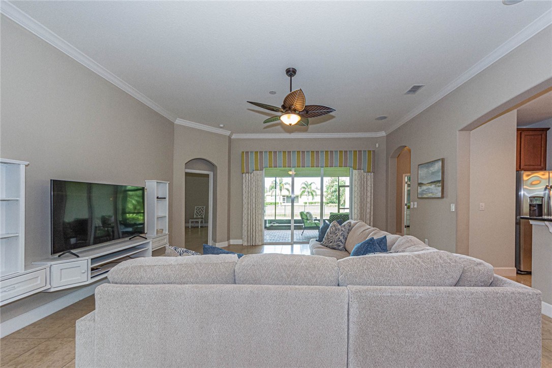 4250 Diamond Square Vero Beach, FL 32967 - Photo 5 of 33 a living room with furniture and a flat screen tv