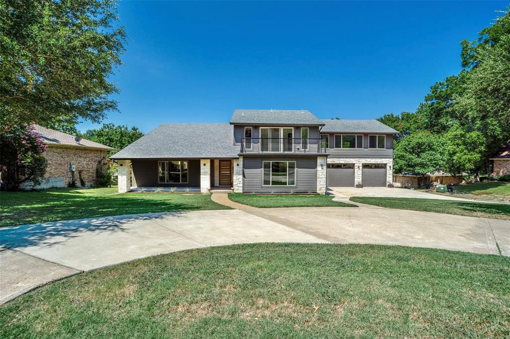 1408 South Alamo Road Rockwall, TX 75087 - Photo 37 of 40 a front view of a house with a yard
