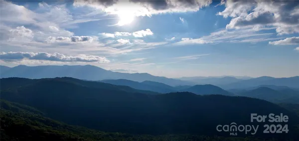 a view of a city with mountains in the background
