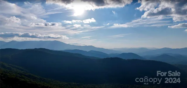 a view of a city with mountains in the background