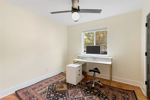 a workspace with furniture and window