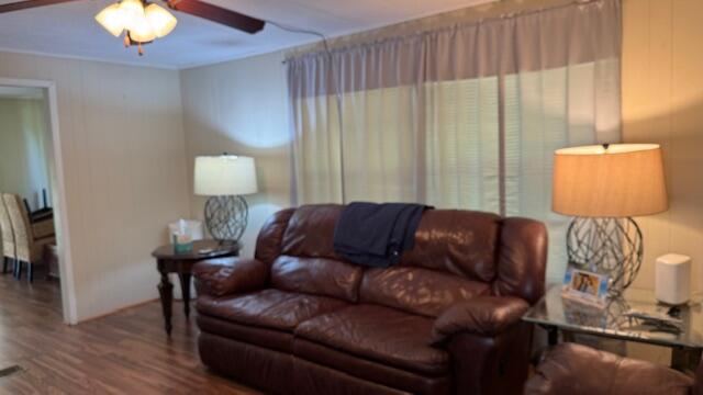 7148 Southeast Seahawk Street Hobe Sound, FL 33455 - Photo 11 of 28 a living room with furniture and a lamp