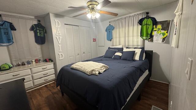 7148 Southeast Seahawk Street Hobe Sound, FL 33455 - Photo 21 of 28 a bedroom with a bed and a chandelier