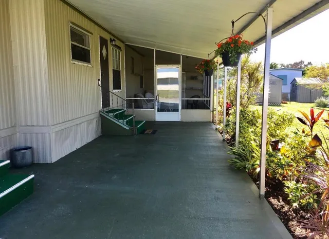 a view of gym equipment with window and furniture