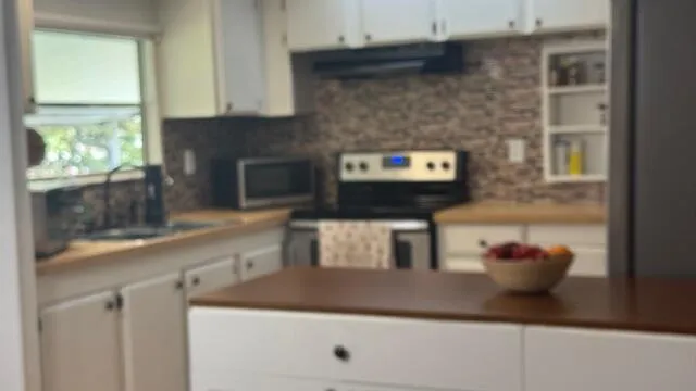 a kitchen with a sink and a microwave