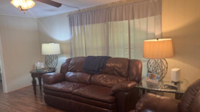 7148 Southeast Seahawk Street Hobe Sound, FL 33455 - Photo 10 of 28 a living room with furniture and a lamp