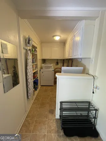 a kitchen with a refrigerator and a stove