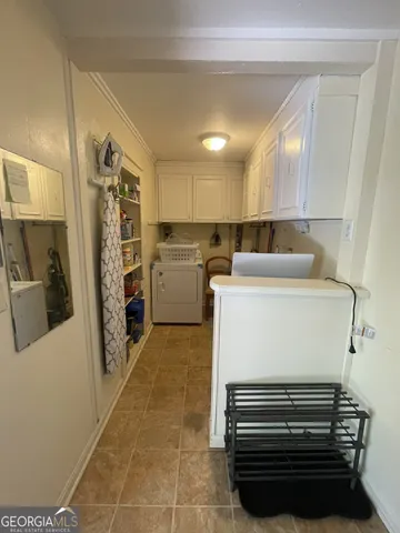 a kitchen with a refrigerator and a stove