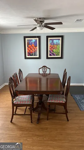 a view of a dining room with furniture