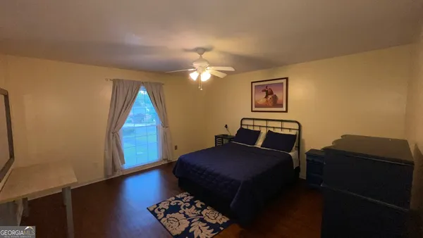 a bed room with a bed and a couch