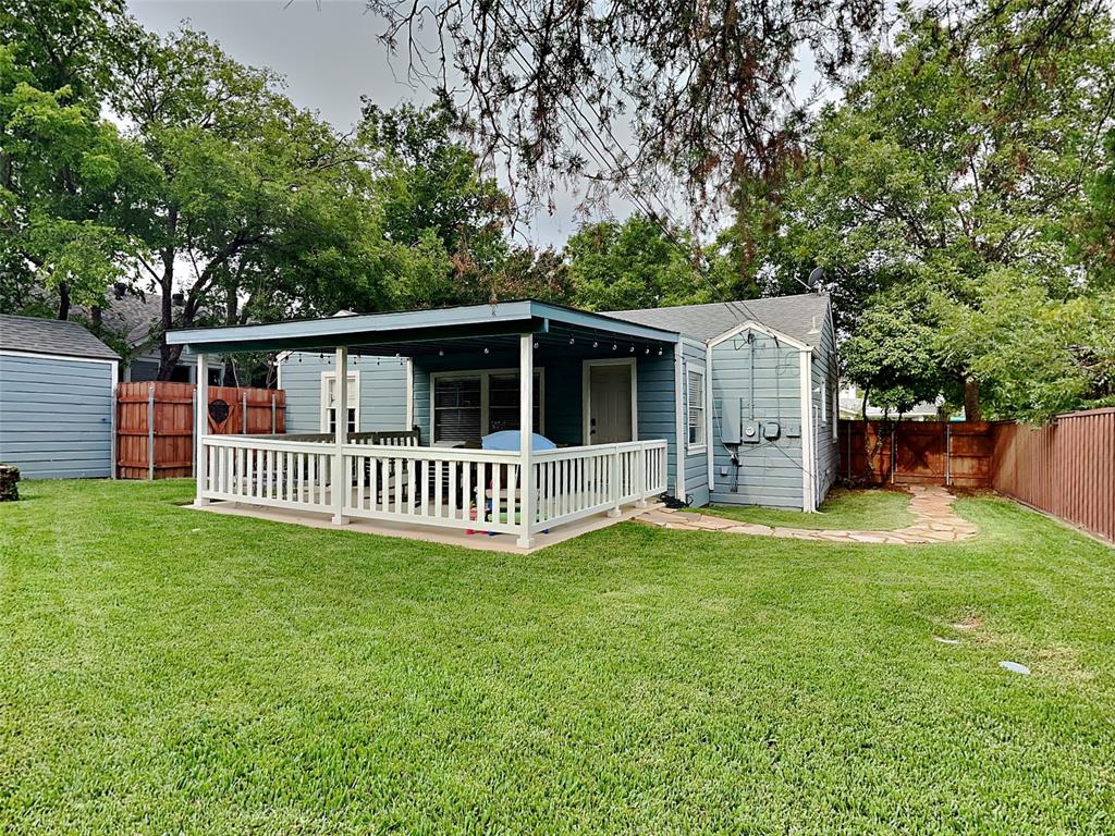 2255 Washington Avenue Fort Worth, TX 76110 - Photo 12 of 12 a view of a house with a backyard and deck