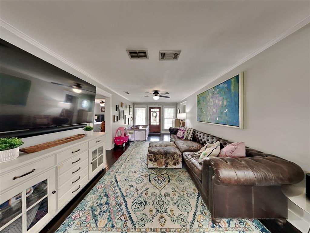 2255 Washington Avenue Fort Worth, TX 76110 - Photo 3 of 12 a living room with furniture and a flat screen tv