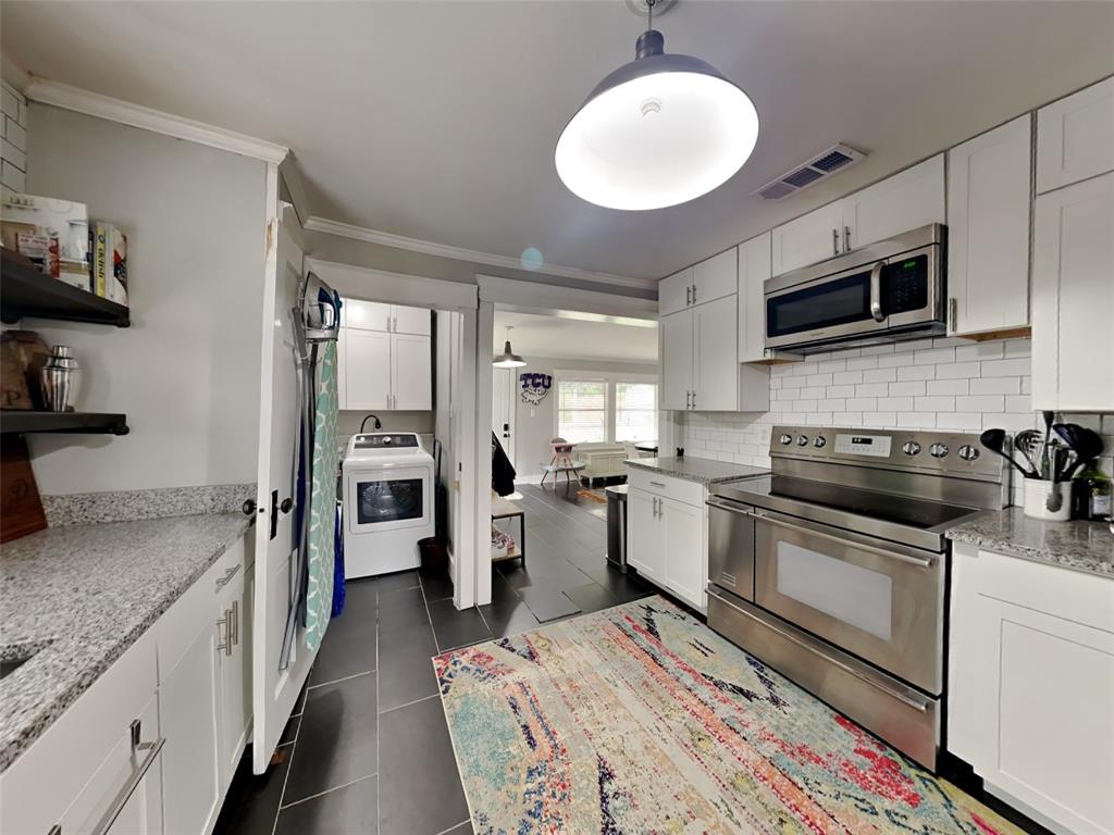 2255 Washington Avenue Fort Worth, TX 76110 - Photo 5 of 12 a kitchen with a sink stove and refrigerator