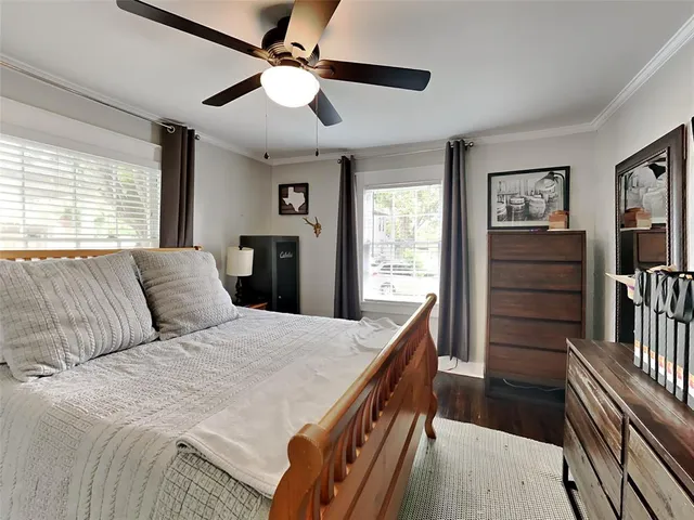 a bedroom with a bed and a dresser