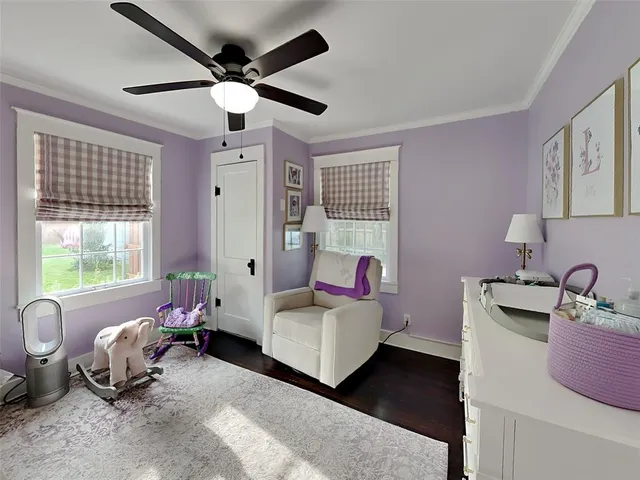 a living room with furniture and windows