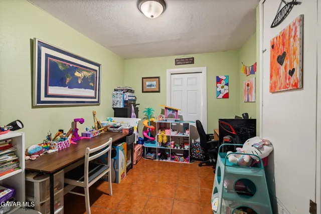 a play room with furniture and toys