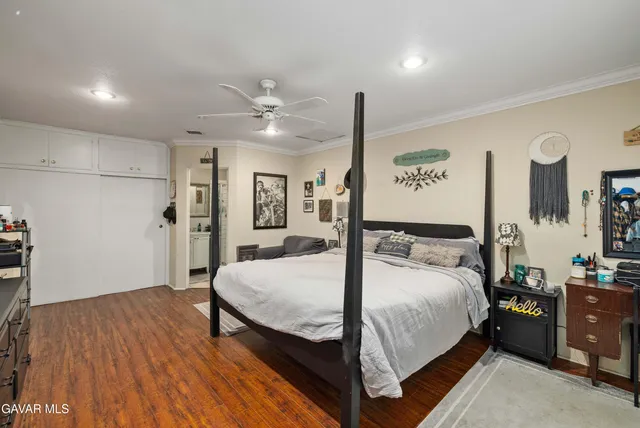 a bed room with a bed and a night stand