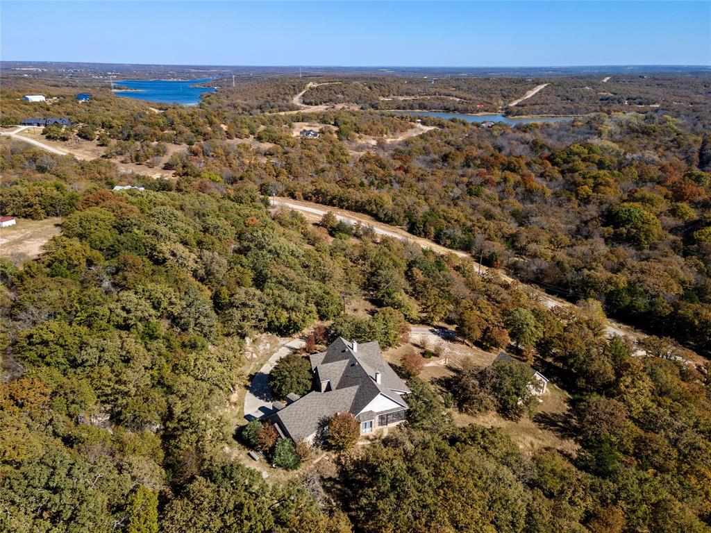 396 Ranchview Court Bowie, TX 76230 - Photo 26 of 38 an aerial view of residential building with trees