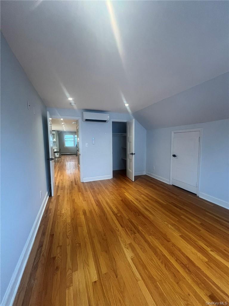 36 Roanoke Avenue, Unit 2 Rye Brook, NY 10573 - Photo 11 of 15 a view of empty room with wooden floor