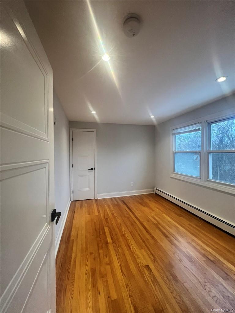 36 Roanoke Avenue, Unit 2 Rye Brook, NY 10573 - Photo 12 of 15 a view of a room with a bed and a window