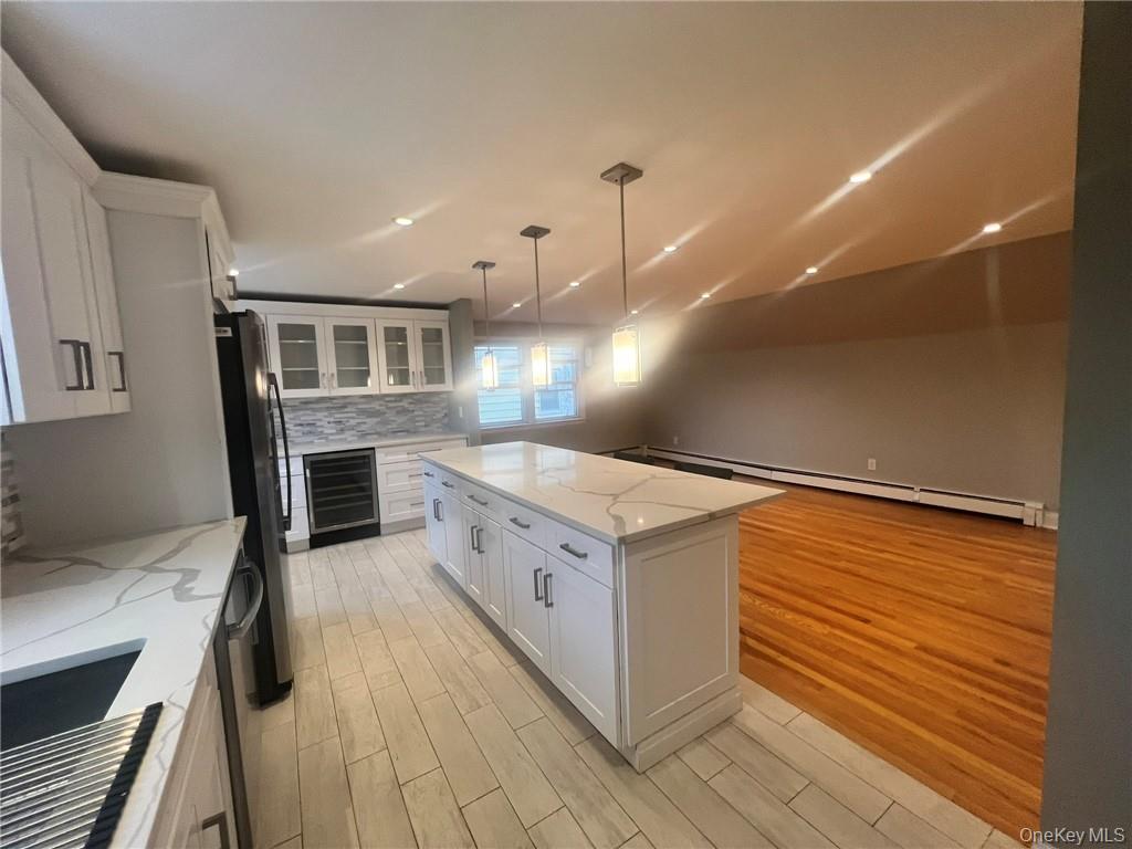 36 Roanoke Avenue, Unit 2 Rye Brook, NY 10573 - Photo 7 of 15 a kitchen with stainless steel appliances granite countertop a stove a sink and a refrigerator