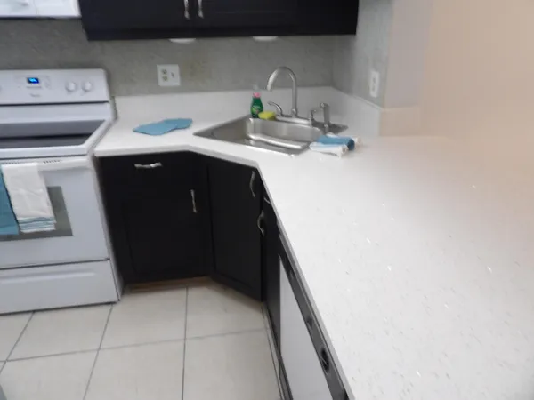 a utility room with sink dryer and washer