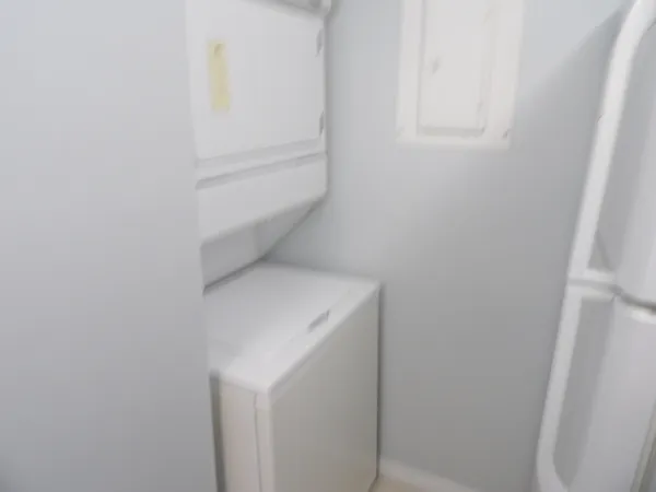 a view of a storage and utility room with washer and dryer