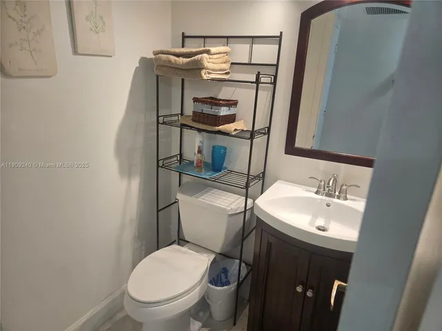 a kitchen with stainless steel appliances kitchen island granite countertop a sink and a stove