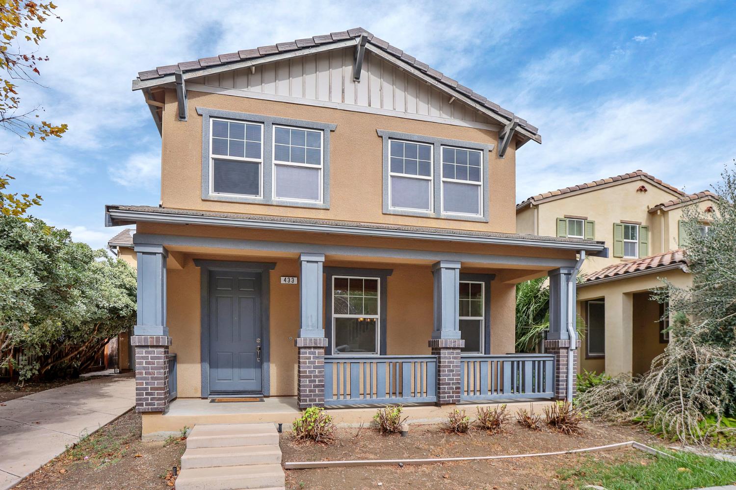 a front view of a house with garden