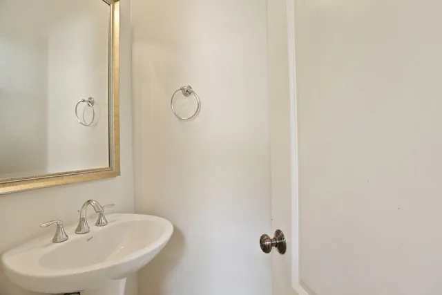 a bathroom with a sink and mirror