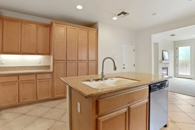a kitchen with a sink and cabinets