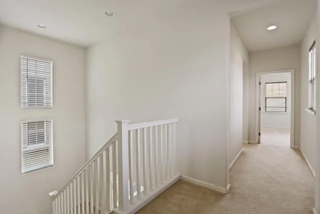 a view of a hallway with windows