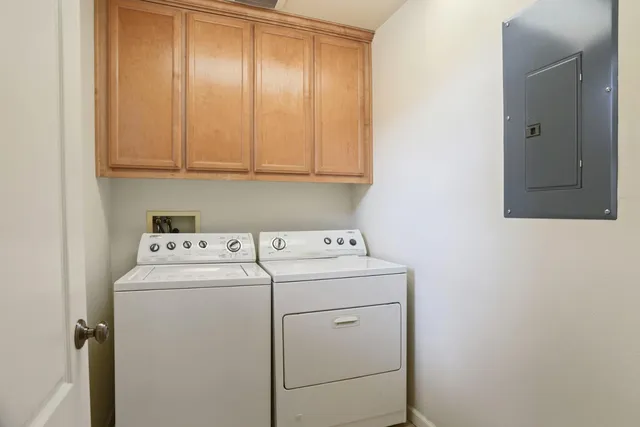 a view of storage and utility room with washer and dryer