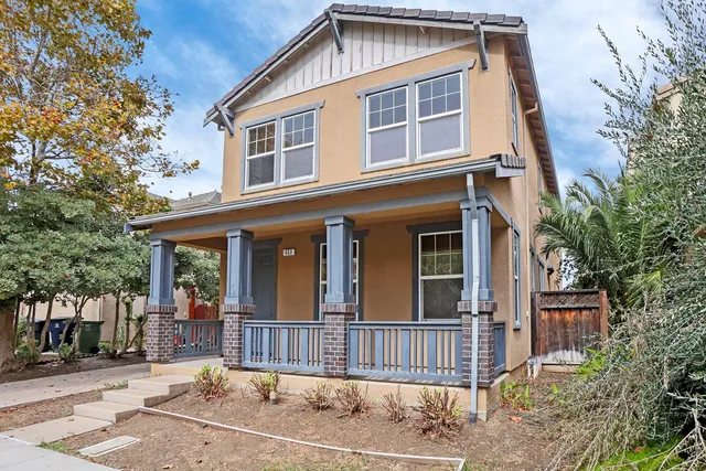 a front view of a house with a fence