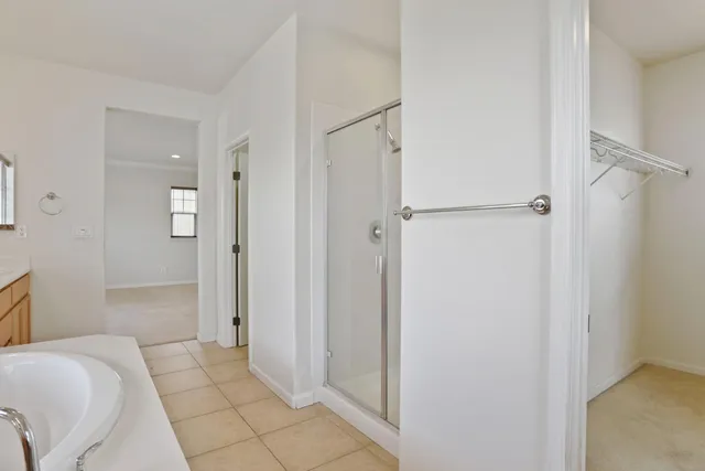 a bathroom with a bathtub and shower