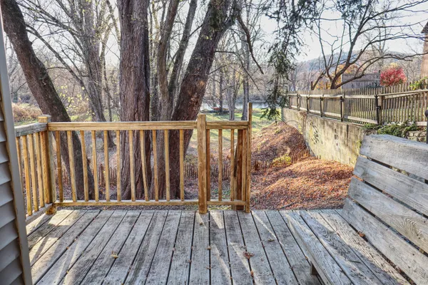 a view of outdoor space with deck and the trees