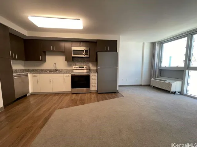 a view of a kitchen with a sink dishwasher and a refrigerator
