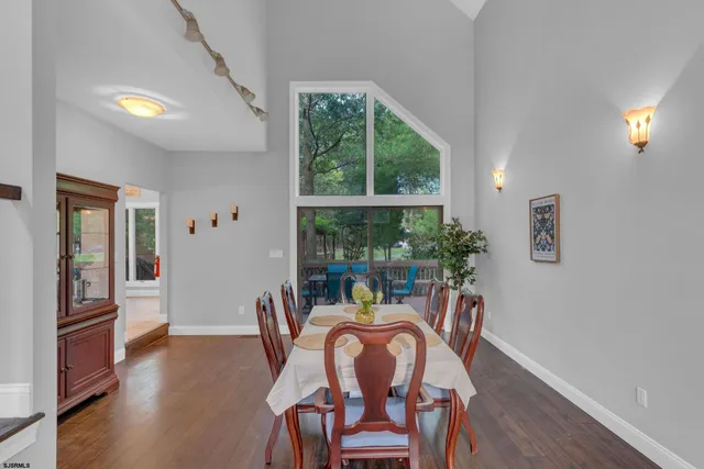 a dining room with furniture window wooden floor