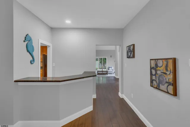 a living room with furniture and a lamp