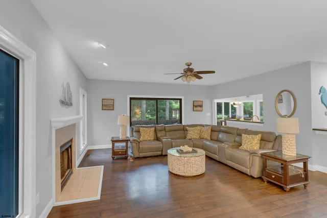 a bathroom with a granite countertop sink and a bathtub
