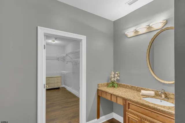 a bedroom with a bed couch and window