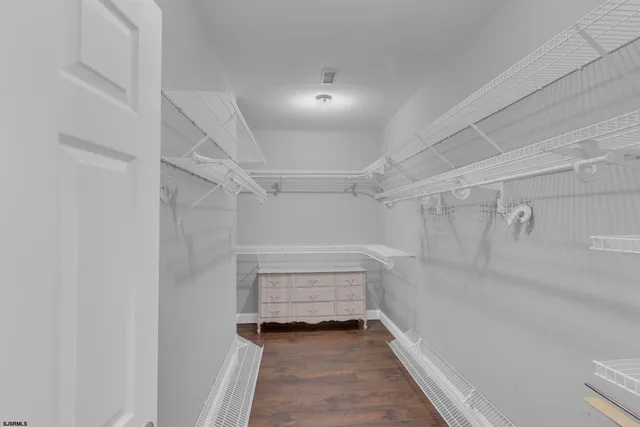 a bedroom with a large bed and a couch