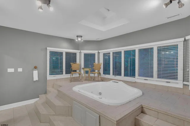 an aerial view of a house with a yard and garden