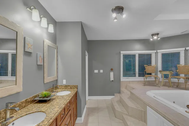 a view of a chair and table in backyard of the house