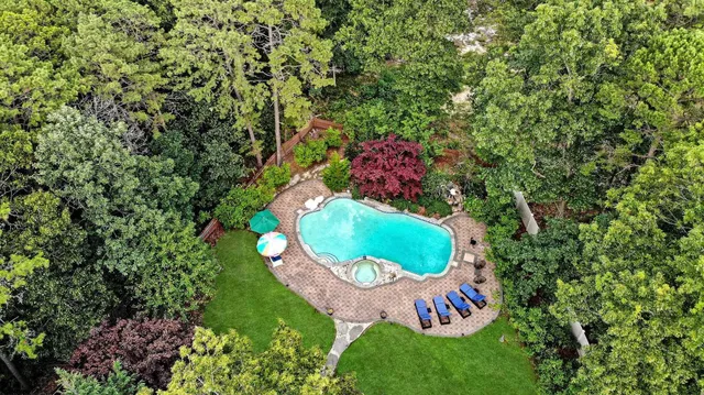 a view of balcony with furniture and garden