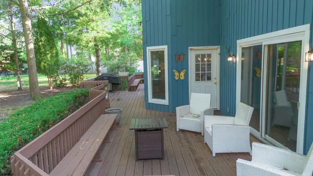 a view of a house with a yard and sitting area