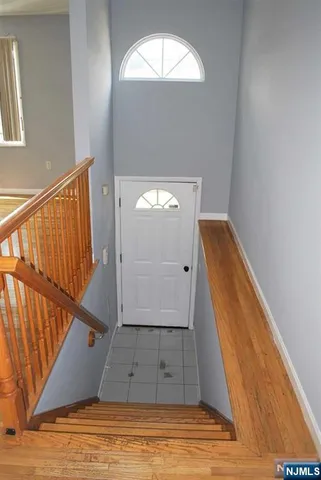 a view of room with wooden floor
