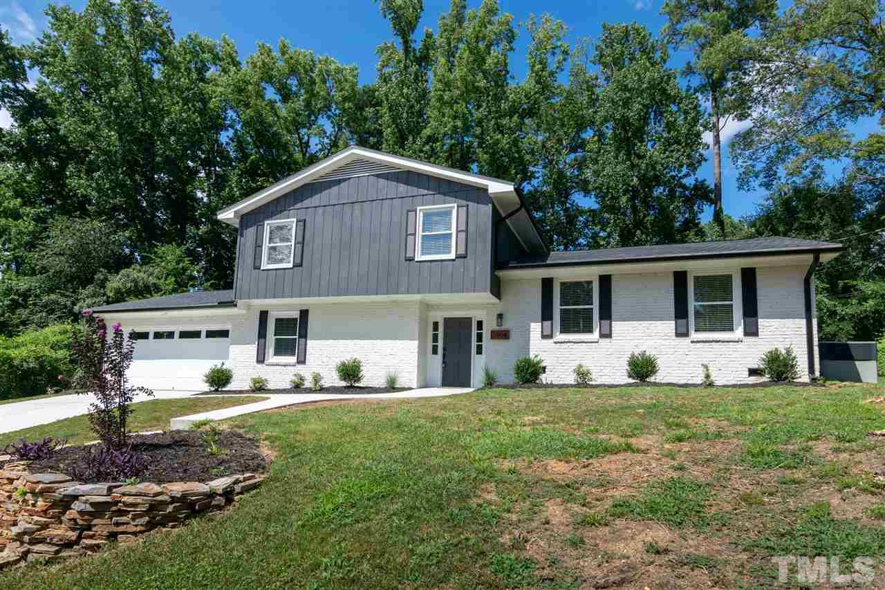 3804 Colgate Place Raleigh, NC 27609 - Photo 1 of 30 a view of a yard in front of a house with large windows