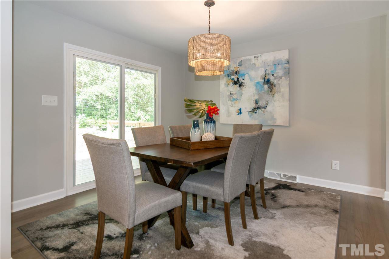 3804 Colgate Place Raleigh, NC 27609 - Photo 14 of 30 a view of a dining room with furniture window and wooden floor
